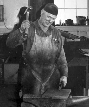 A_blacksmith_at_work_from_the_early_1900s.jpg