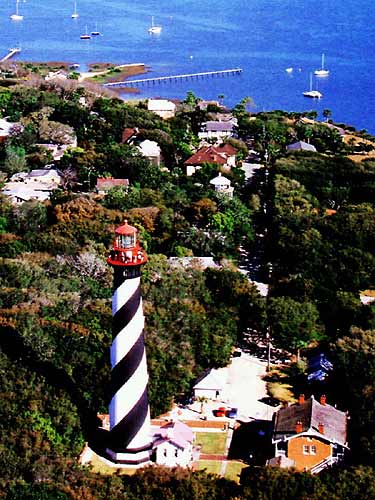 St. Augustine was the site of the first lighthouse established in Florida in 1824. By 1870, beach erosion threatened the first lighthouse.  Construction on a new light tower began in 1871 during Florida's  reconstruction period.  In the meantime a jetty of coquina and brush was  built to protect the old tower.  A trolley track brought building supplies from the ships at the dock. The new tower was completed in 1874,  and put into service with a new first order Fresnel lens. It was lit for the first time in October by keeper William Russell. Russell was the first lighthouse keeper in the new tower. He was the only keeper to have worked both towers.  St. Augustine Lighthouse St. Augustine, FL